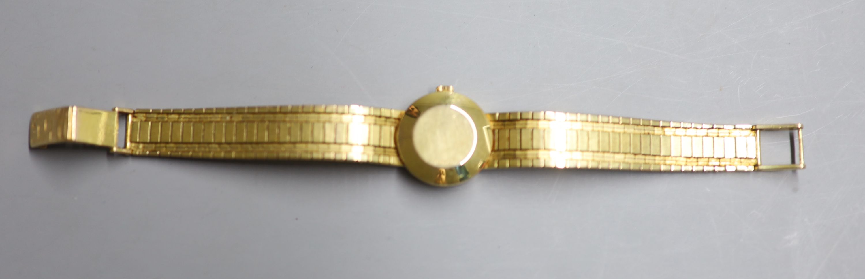 A ladys 9ct gold Eterna-Matic manual wind wrist watch, on a 9ct gold bracelet, overall 16cm, gross 30.7 grams.